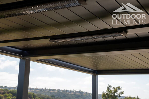 Twin infrared heaters mounted under pergola roof with hillside view