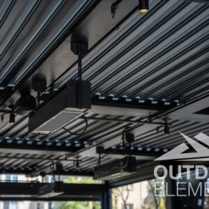 Outdoor infrared heaters and speakers mounted inside louvered pergola ceiling