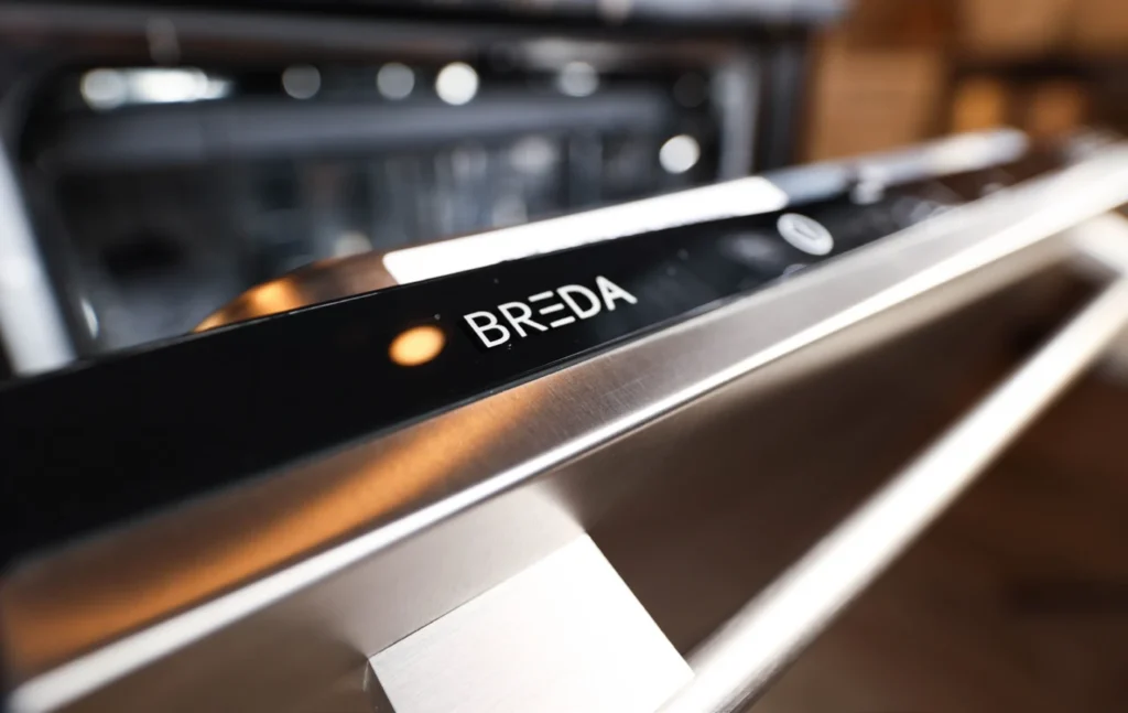 Close-up of Breda built-in kitchen appliance stainless steel handle and control panel