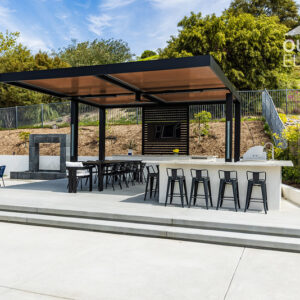 Cantilevered pergola over outdoor bar and dining seating on elevated concrete patio