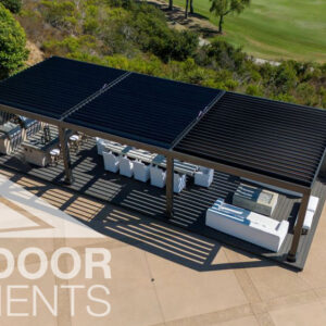 Aerial view of louvered pergola covering outdoor kitchen and lounge seating on patio